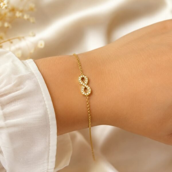 Stone studded infinity bracelet